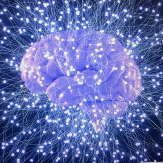 an image of an illuminated brain with starburst extending all around it