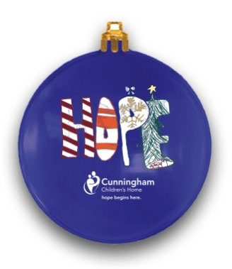 royal blue circle Christmas ornament with the Cunningham logo and youth artwork with the word hope