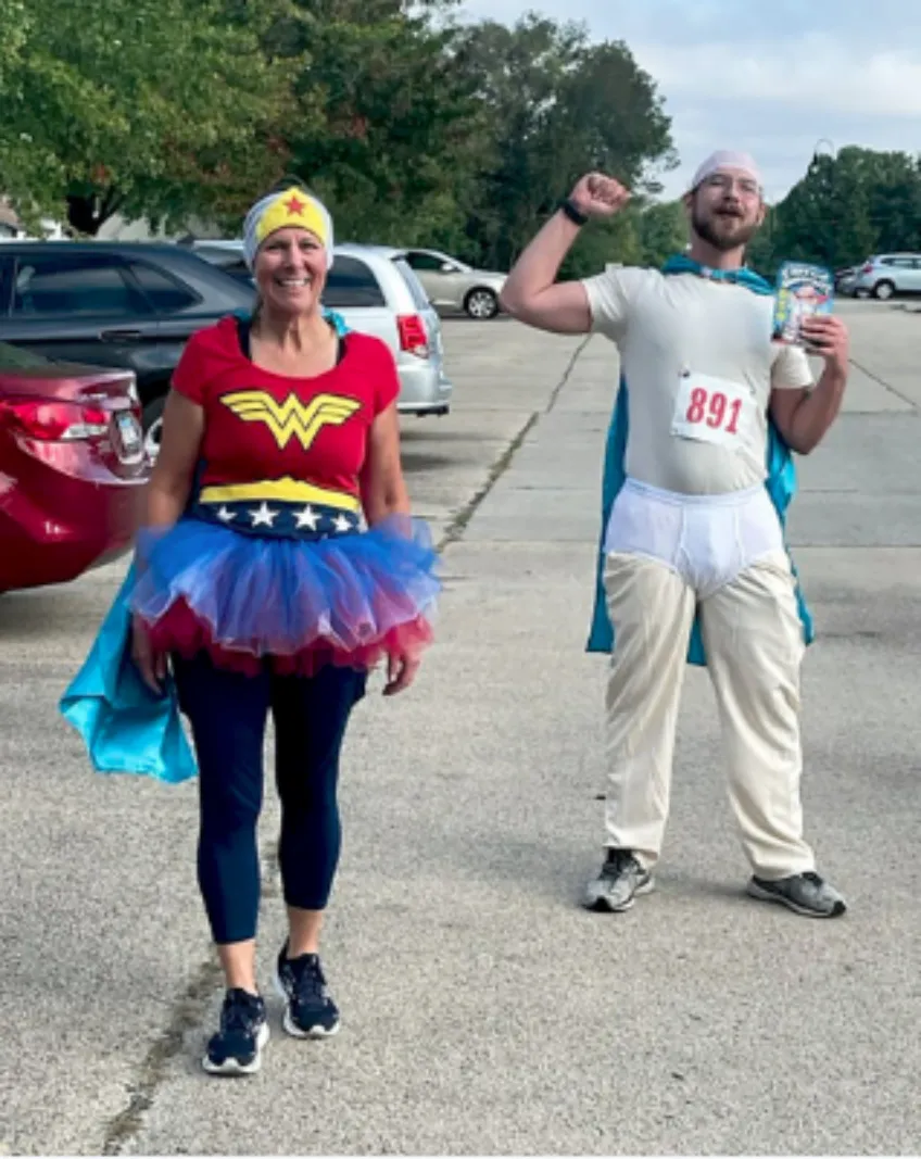 Woman dressed as wonder woman and man dressed as Captain Underpants at the Be a Hero 5K